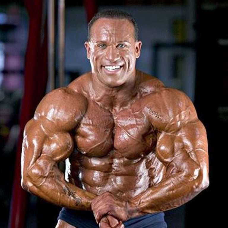 Bodybuilder posing displaying symmetry